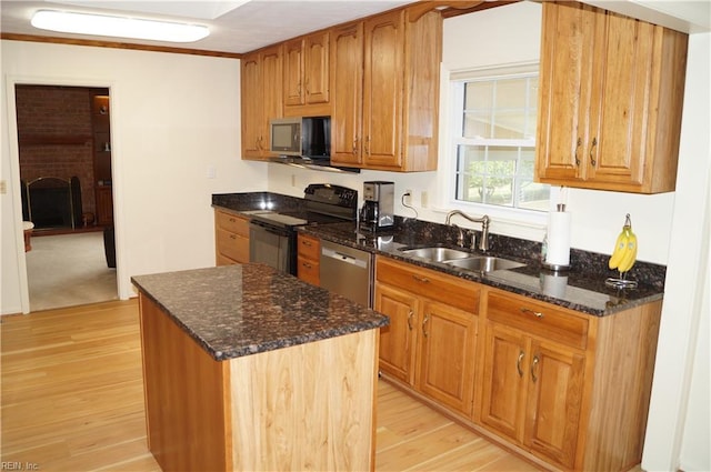 9 Chowning Dr, Hampton, VA 23664 - kitchen with stainless steel appliances, a sink, light wood finished floors, and dark stone counters