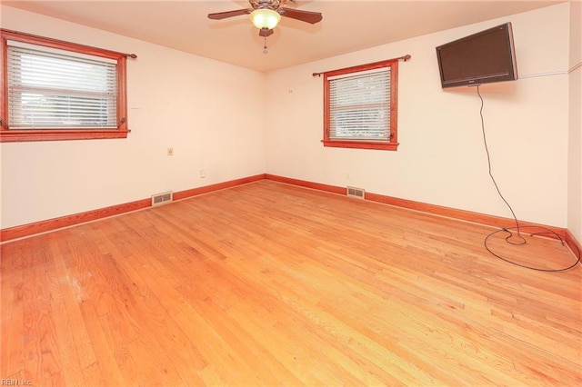 101 Elmhurst Ln, Portsmouth, VA 23701 - unfurnished room featuring light wood finished floors, ceiling fan, and baseboards