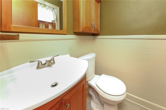 101 Elmhurst Ln, Portsmouth, VA 23701 - half bath featuring vanity, toilet, and wainscoting