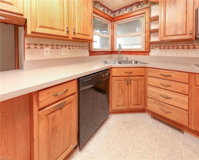 101 Elmhurst Ln, Portsmouth, VA 23701 - kitchen featuring black dishwasher, a sink, backsplash, and light countertops