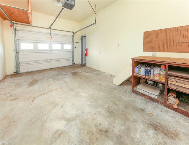 101 Elmhurst Ln, Portsmouth, VA 23701 - garage with a garage door opener and a workshop area