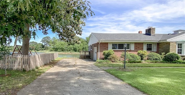 101 Elmhurst Ln, Portsmouth, VA 23701 - view of property exterior with concrete driveway, brick siding, and a chimney
