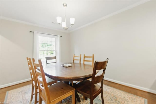 101 Huxley Pl, Newport News, VA 23606 - dining area with a chandelier, wood finished floors, baseboards, and crown molding