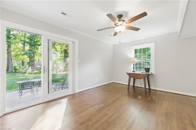 101 Huxley Pl, Newport News, VA 23606 - spare room featuring crown molding, a ceiling fan, wood finished floors, and baseboards
