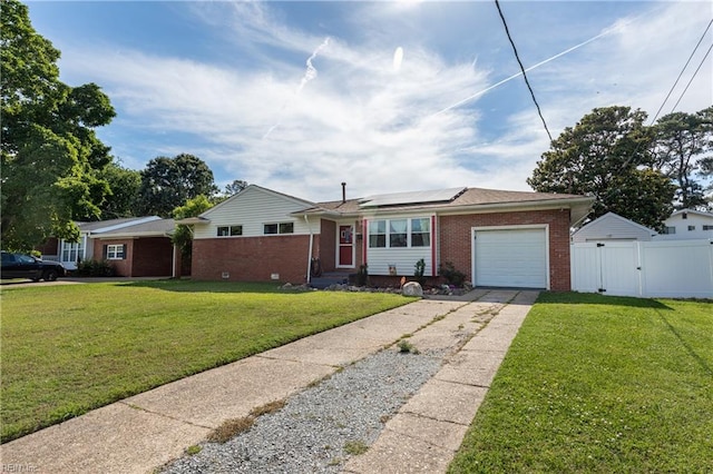 8121 Walters Dr, Norfolk, VA 23518 - single story home featuring brick siding, a gate, a garage, solar panels, and concrete driveway
