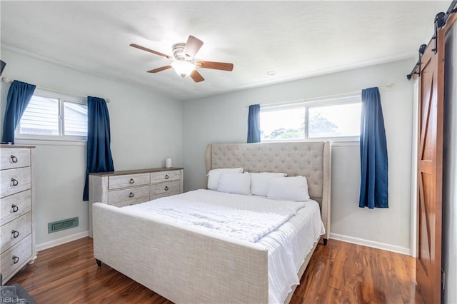 8121 Walters Dr, Norfolk, VA 23518 - bedroom featuring multiple windows, dark wood-style flooring, and ceiling fan
