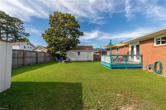 8121 Walters Dr, Norfolk, VA 23518 - fenced backyard featuring a wooden deck and a shed