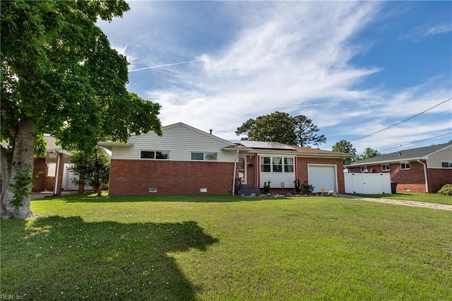 8121 Walters Dr, Norfolk, VA 23518 - ranch-style home featuring concrete driveway, brick siding, an attached garage, and solar panels