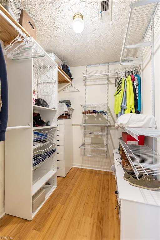11 Thomas Athey Ct, Hampton, VA 23666 - walk in closet with light wood-type flooring