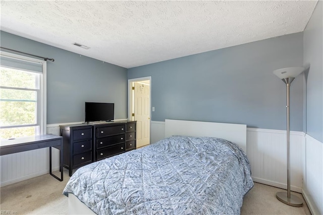 11 Thomas Athey Ct, Hampton, VA 23666 - carpeted bedroom featuring a wainscoted wall and a textured ceiling