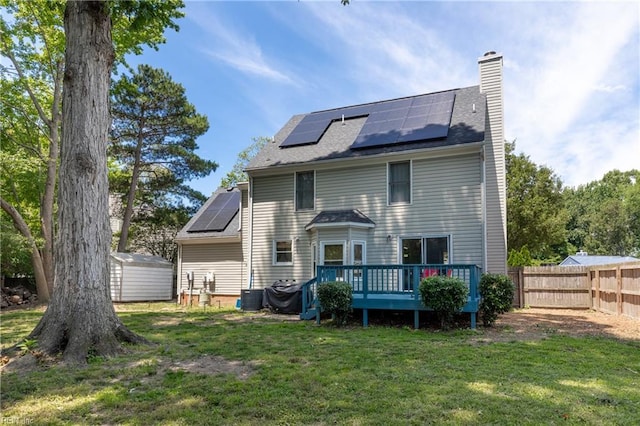 11 Thomas Athey Ct, Hampton, VA 23666 - rear view of property with solar panels, a chimney, and a deck