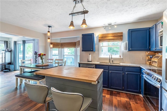 11 Thomas Athey Ct, Hampton, VA 23666 - kitchen featuring blue cabinets, a sink, appliances with stainless steel finishes, butcher block counters, and a textured ceiling