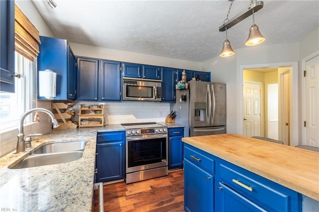 11 Thomas Athey Ct, Hampton, VA 23666 - kitchen with appliances with stainless steel finishes, a sink, blue cabinets, dark wood finished floors, and a textured ceiling