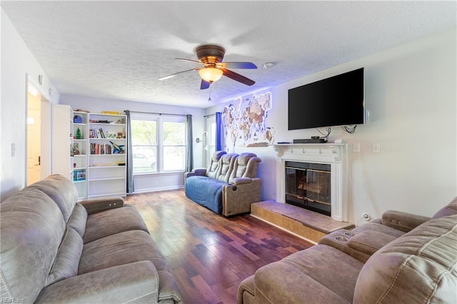 11 Thomas Athey Ct, Hampton, VA 23666 - living area featuring ceiling fan, a textured ceiling, wood finished floors, and a glass covered fireplace