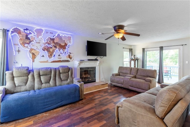 11 Thomas Athey Ct, Hampton, VA 23666 - living room with wood finished floors, ceiling fan, a textured ceiling, and a glass covered fireplace