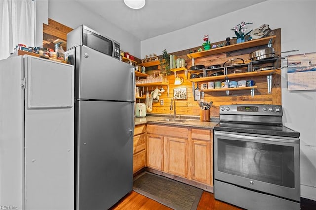 632 Raleigh Ave Unit 3, Norfolk, VA 23507 - kitchen with appliances with stainless steel finishes, open shelves, a sink, and wood finished floors