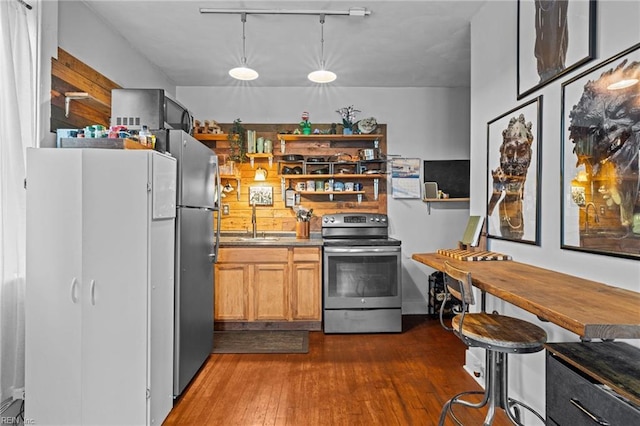 632 Raleigh Ave Unit 3, Norfolk, VA 23507 - kitchen with appliances with stainless steel finishes, dark wood-type flooring, a sink, open shelves, and pendant lighting