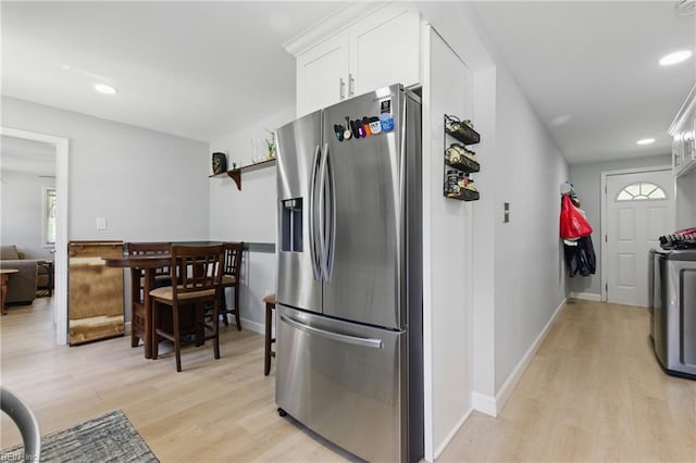 611 74th St, Newport News, VA 23605 - kitchen featuring stainless steel fridge, light wood-style flooring, white cabinets, recessed lighting, and washing machine and clothes dryer