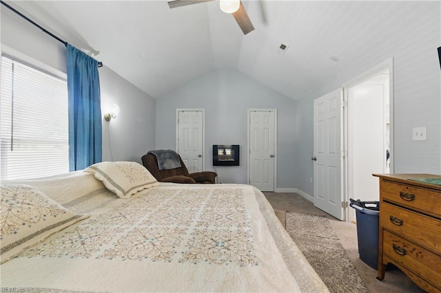 611 74th St, Newport News, VA 23605 - bedroom featuring vaulted ceiling, light colored carpet, a ceiling fan, two closets, and baseboards