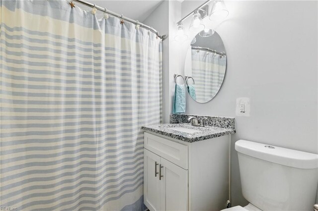 611 74th St, Newport News, VA 23605 - full bathroom featuring toilet and vanity