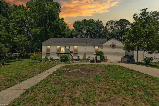 611 74th St, Newport News, VA 23605 - view of front facade with a yard