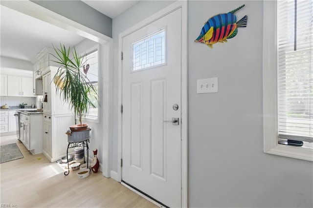 611 74th St, Newport News, VA 23605 - foyer entrance with plenty of natural light and light wood-style floors