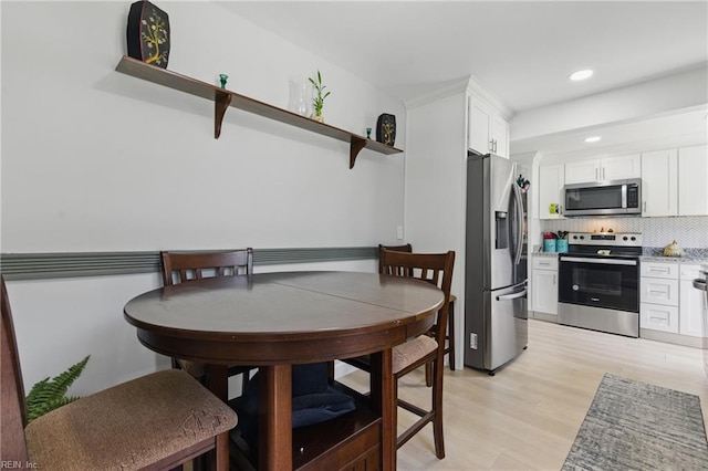 611 74th St, Newport News, VA 23605 - dining space with light wood-style floors and recessed lighting