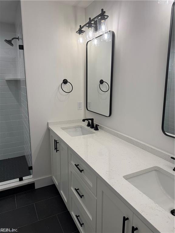617 Dam Neck Rd, Virginia Beach, VA 23454 - bathroom with double vanity, tile patterned flooring, and a stall shower