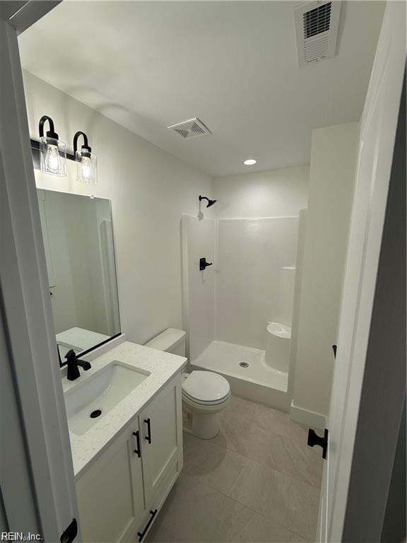 617 Dam Neck Rd, Virginia Beach, VA 23454 - bathroom with vanity, a walk in shower, toilet, and recessed lighting