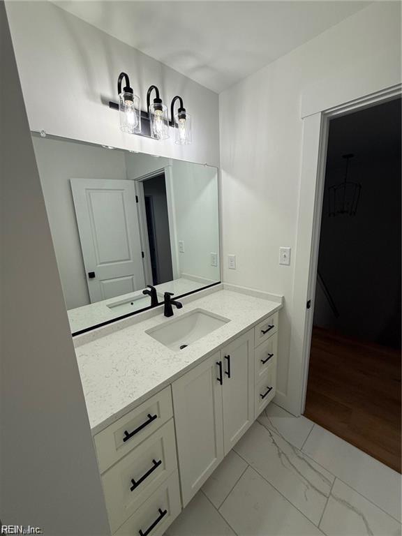 617 Dam Neck Rd, Virginia Beach, VA 23454 - bathroom with vanity and marble look tiles