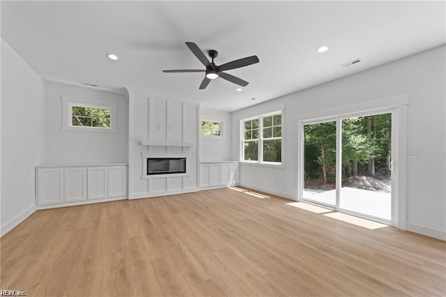 617 Dam Neck Rd, Virginia Beach, VA 23454 - unfurnished living room featuring healthy amount of natural light, light wood-type flooring, ceiling fan, a fireplace, and recessed lighting