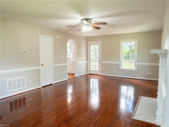 400 Fernwood Farms Rd, Chesapeake, VA 23320 - unfurnished living room with ceiling fan, arched walkways, wood finished floors, and baseboards