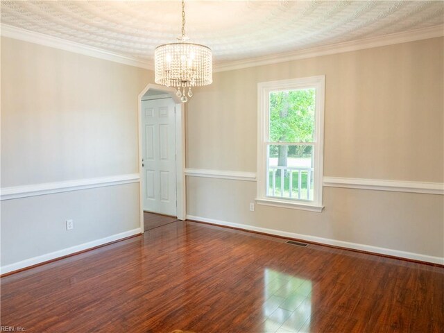 400 Fernwood Farms Rd, Chesapeake, VA 23320 - empty room with wood finished floors, a chandelier, baseboards, arched walkways, and crown molding