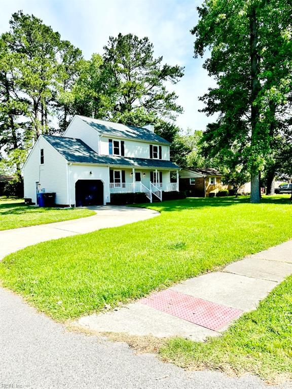 400 Fernwood Farms Rd, Chesapeake, VA 23320 - view of front facade featuring covered porch, a front yard, concrete driveway, and an attached garage