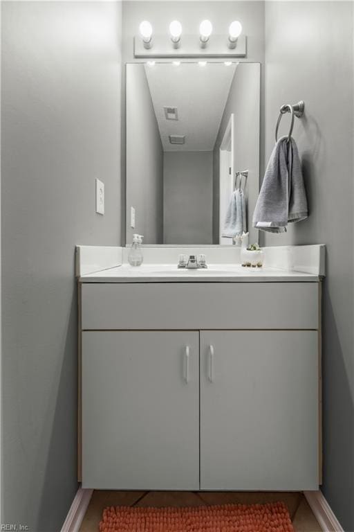 606 Queens Xing, Williamsburg, VA 23185 - bathroom with vanity and baseboards