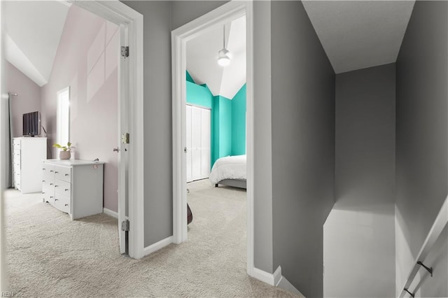 606 Queens Xing, Williamsburg, VA 23185 - hallway featuring lofted ceiling, light carpet, and baseboards