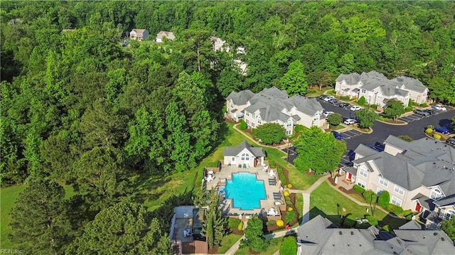 606 Queens Xing, Williamsburg, VA 23185 - view of property location featuring a heavily wooded area, a pool area, and nearby suburban area