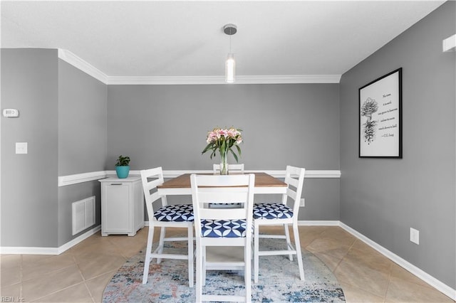 606 Queens Xing, Williamsburg, VA 23185 - dining room with light tile patterned flooring, crown molding, and baseboards