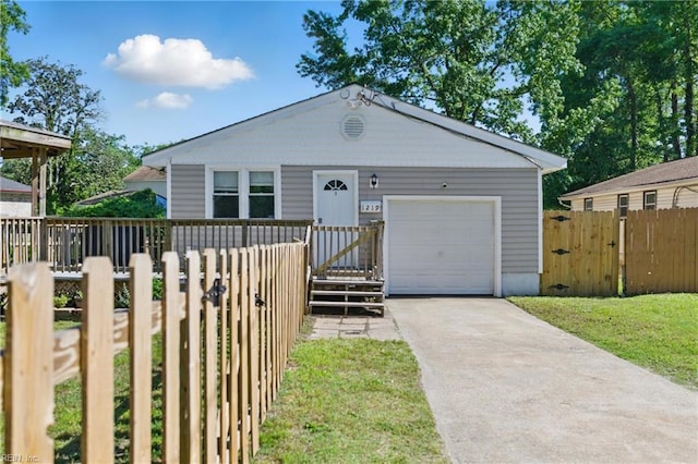 1219 Milton St, Norfolk, VA 23505 - view of front of home featuring concrete driveway, a garage, and a gate