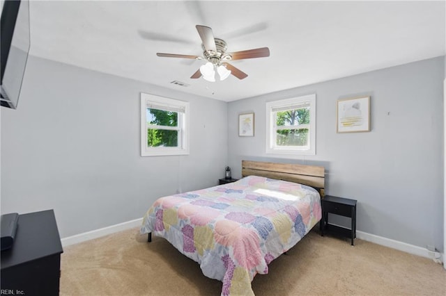 1219 Milton St, Norfolk, VA 23505 - bedroom with light colored carpet, multiple windows, baseboards, and a ceiling fan