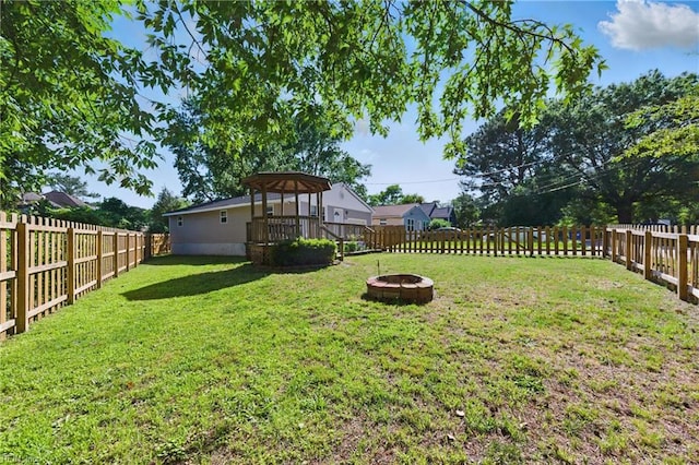 1219 Milton St, Norfolk, VA 23505 - view of yard featuring a fire pit, a gazebo, and a wooden deck