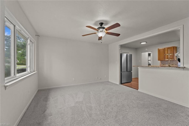 3521 Melinda Pl, Virginia Beach, VA 23452 - unfurnished living room with a ceiling fan, light colored carpet, and baseboards