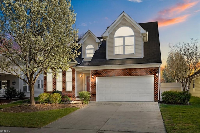 2673 Einstein Dr, Virginia Beach, VA 23456 - view of front of home with brick siding, concrete driveway, a garage, and roof with shingles