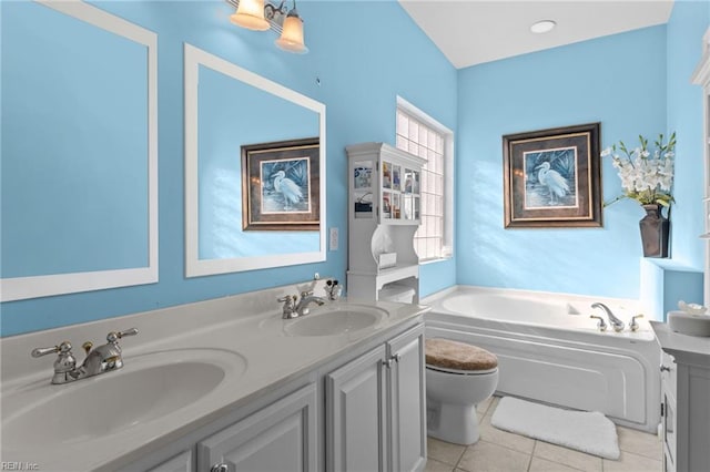 2673 Einstein Dr, Virginia Beach, VA 23456 - bathroom featuring a bath, toilet, double vanity, and tile patterned flooring