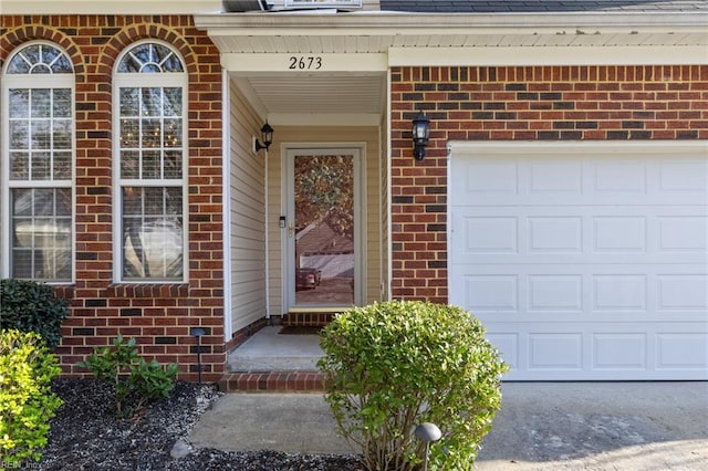 2673 Einstein Dr, Virginia Beach, VA 23456 - property entrance with brick siding, a garage, and a shingled roof
