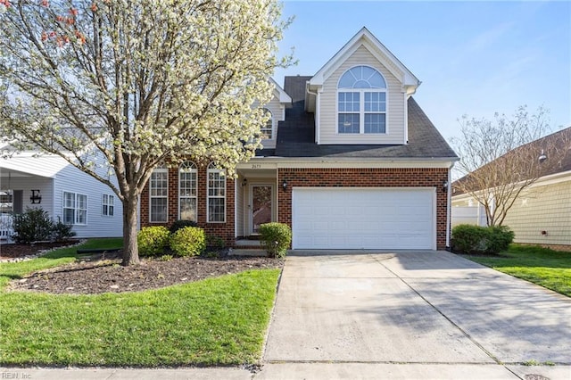 2673 Einstein Dr, Virginia Beach, VA 23456 - view of front facade featuring brick siding, driveway, a garage, and a front lawn