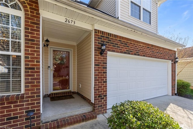 2673 Einstein Dr, Virginia Beach, VA 23456 - property entrance with brick siding, an attached garage, and driveway