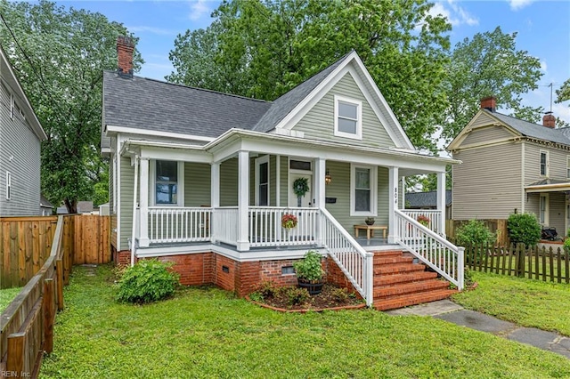 804 E Pembroke Ave, Hampton, VA 23669 - view of front facade featuring covered porch, roof with shingles, and a chimney