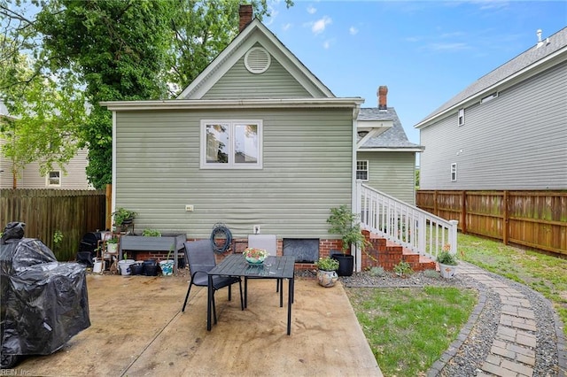 804 E Pembroke Ave, Hampton, VA 23669 - back of property featuring a patio area, a fenced backyard, and a chimney