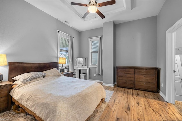 804 E Pembroke Ave, Hampton, VA 23669 - bedroom featuring a raised ceiling, hardwood / wood-style flooring, baseboards, and ceiling fan